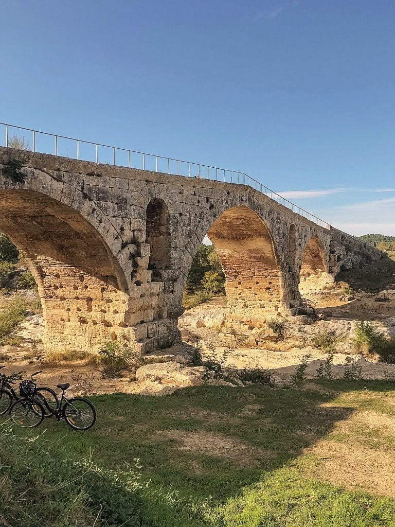 The Pont Julien, a Roman bridge near Bonnieux, with bikes